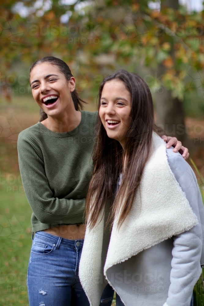 Image Of Young Lesbian Couple Hugging And Laughing Outdoors Austockphoto