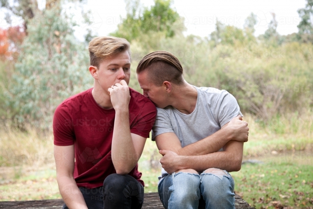 Young male same sex couple in a rural setting - Australian Stock Image