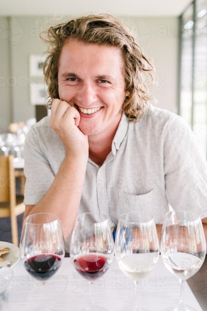 young man at a wine tasting - Australian Stock Image