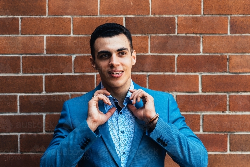 young man in blue suit - Australian Stock Image