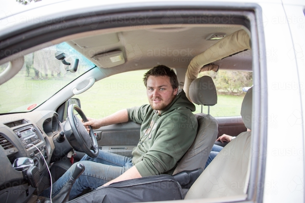 Young man in drivers seat of ute - Australian Stock Image