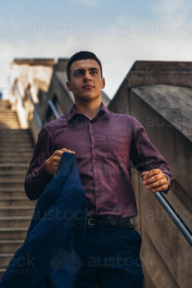 young man on stairs - Australian Stock Image