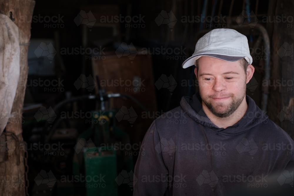 Young Man smiling in a Shed - Australian Stock Image