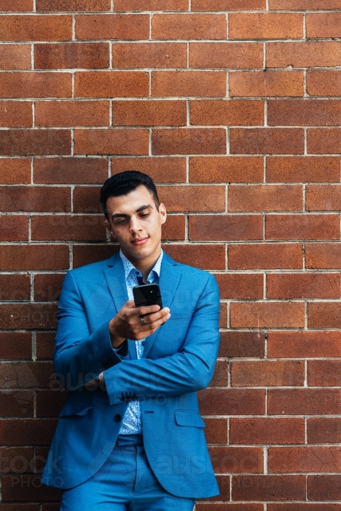 young man using phone - Australian Stock Image