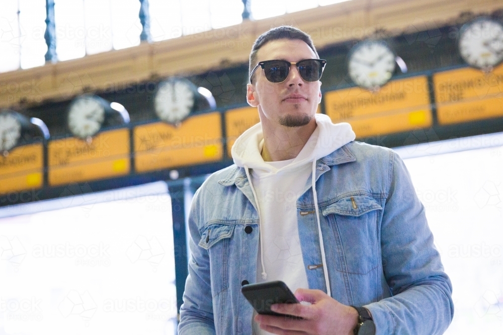 Young Man Waiting at Flinders Street Station - Australian Stock Image
