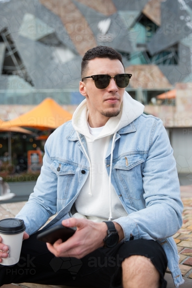 Young Man Waiting in Federation Square - Australian Stock Image