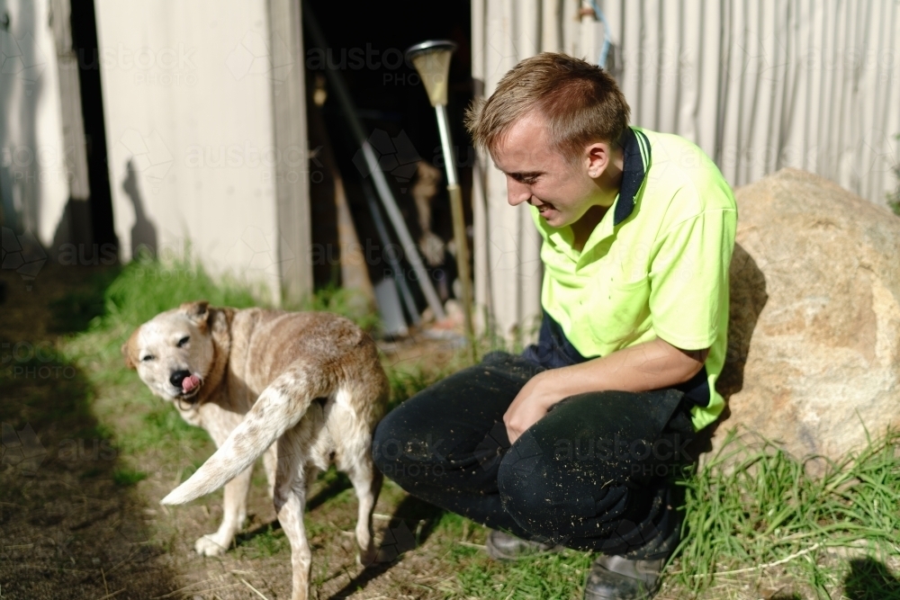 Young Man with a Farm Dog - Australian Stock Image