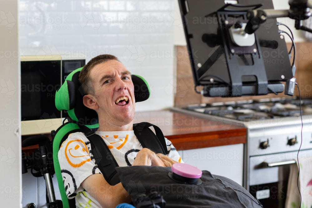 Disability Man Image of Young man with disability on his wheelchair smiling at ...