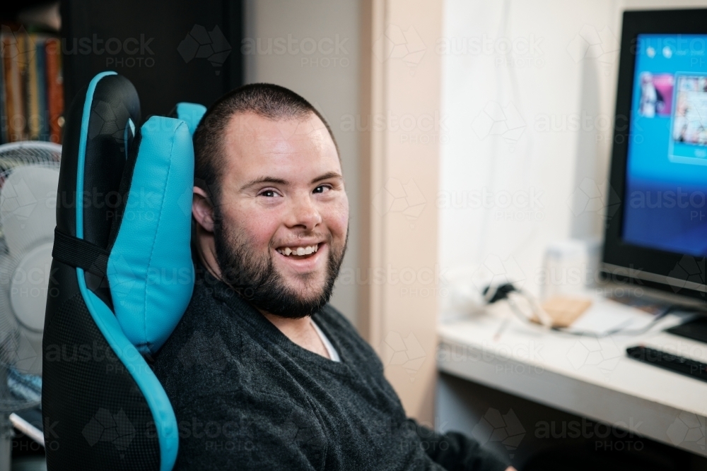 Image of Young Man with Down Syndrome about to do some Video Gaming ...