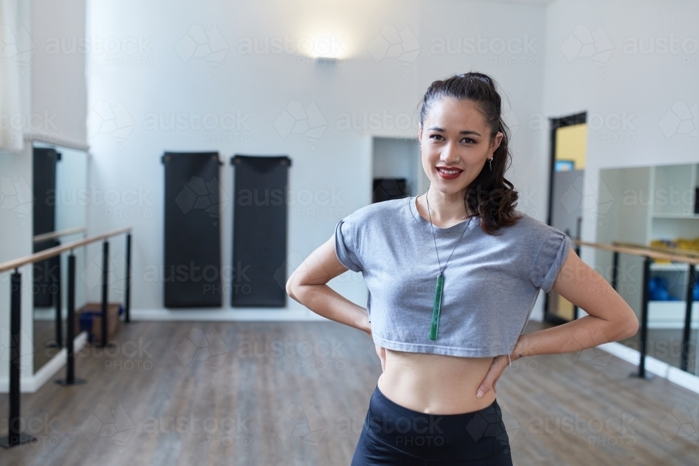 Young Maori dancer standing in studio - Australian Stock Image