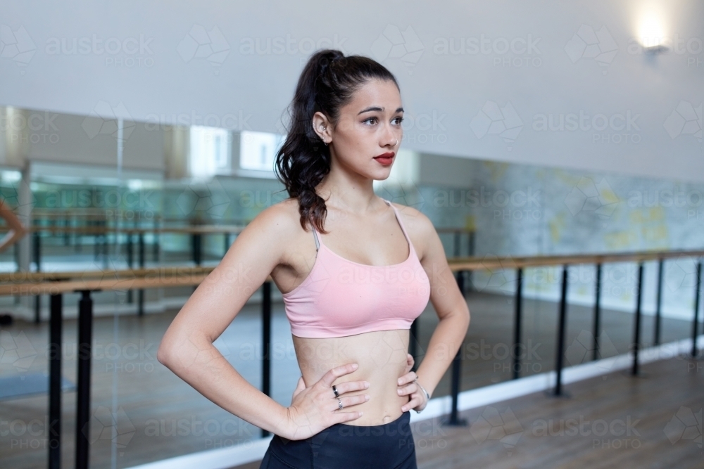 Young Maori woman training in dance studio - Australian Stock Image