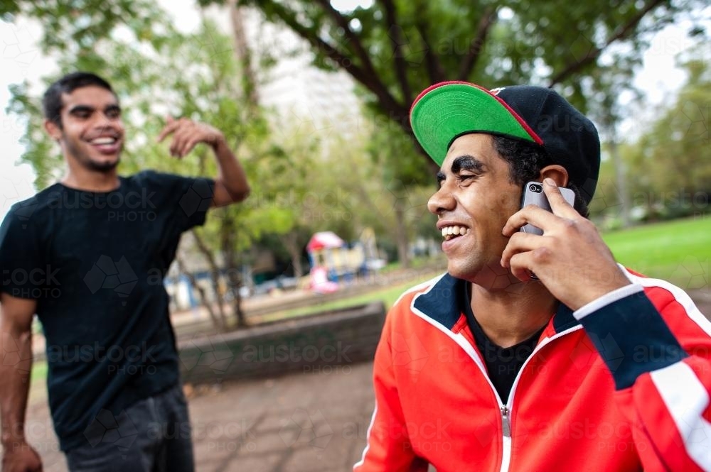 Young Men in a Park having a Joke - Australian Stock Image