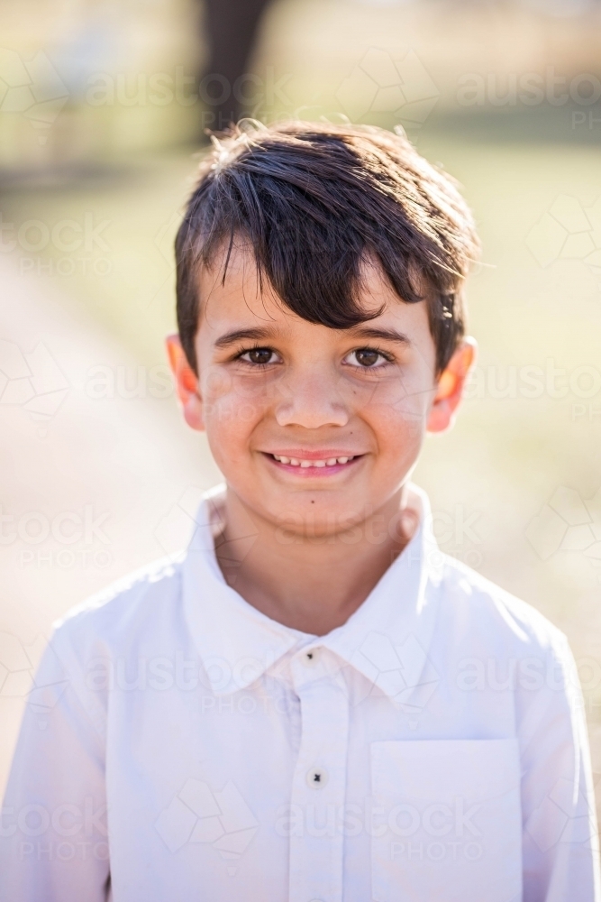 Image of Young mixed race Aboriginal and Caucasian boy smiling Austockphoto