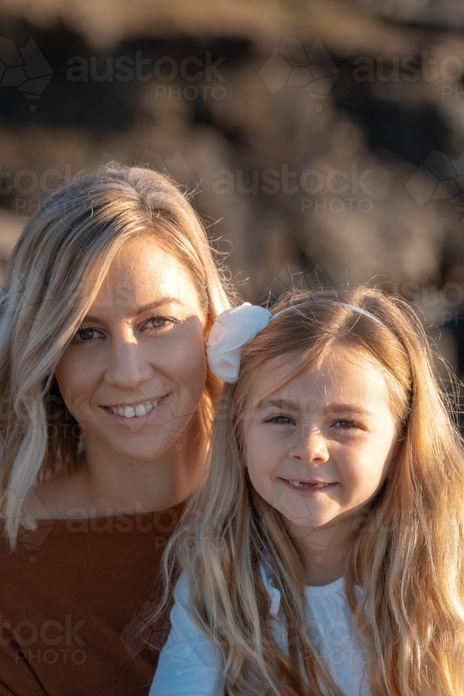 Young mother and daughter portrait at sunrise - Australian Stock Image