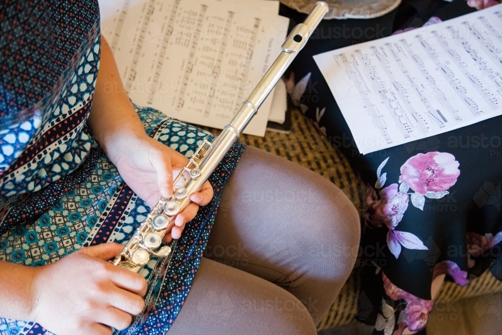 Young musical lady holding a flute - Australian Stock Image