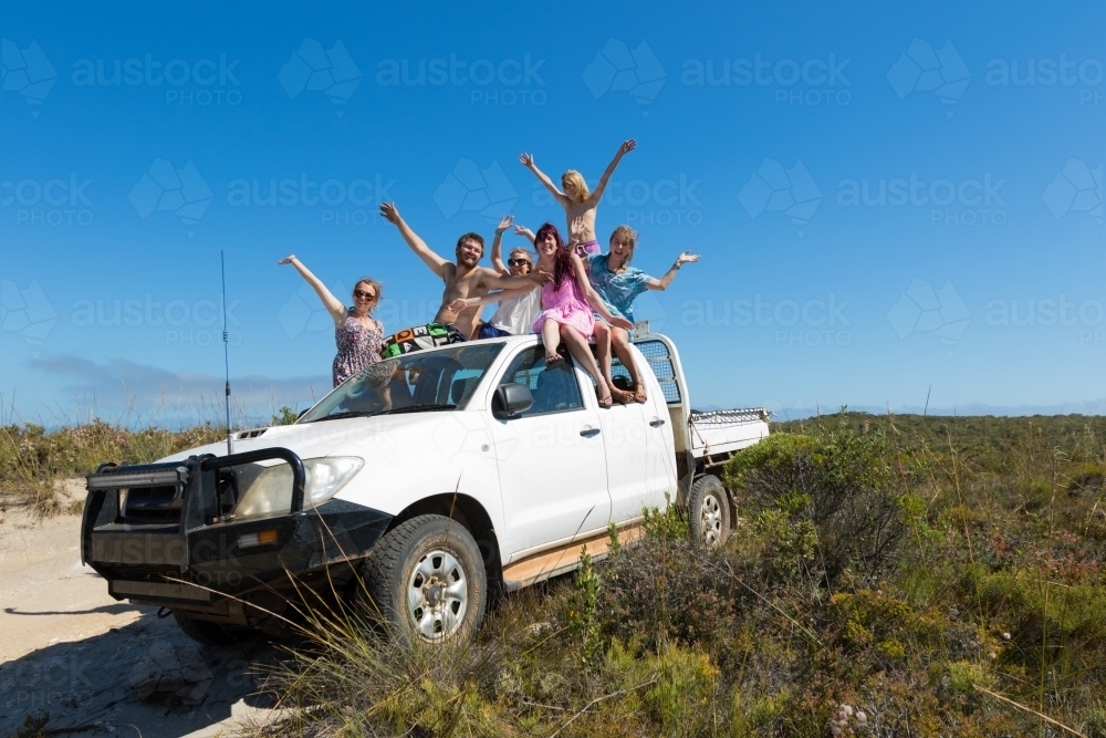 Young people having fun on roof of ute - Australian Stock Image