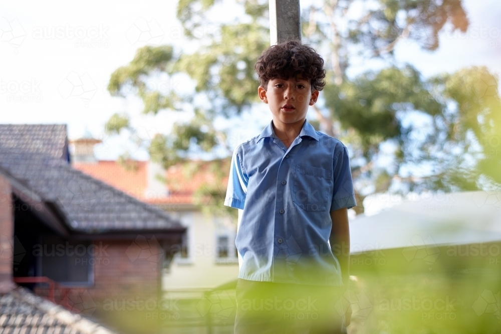 Young school boy at school outdoors - Australian Stock Image