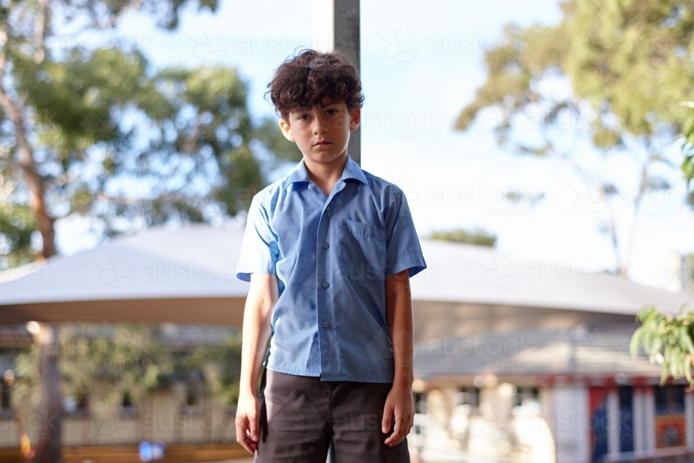 Young school boy with despondent expression - Australian Stock Image