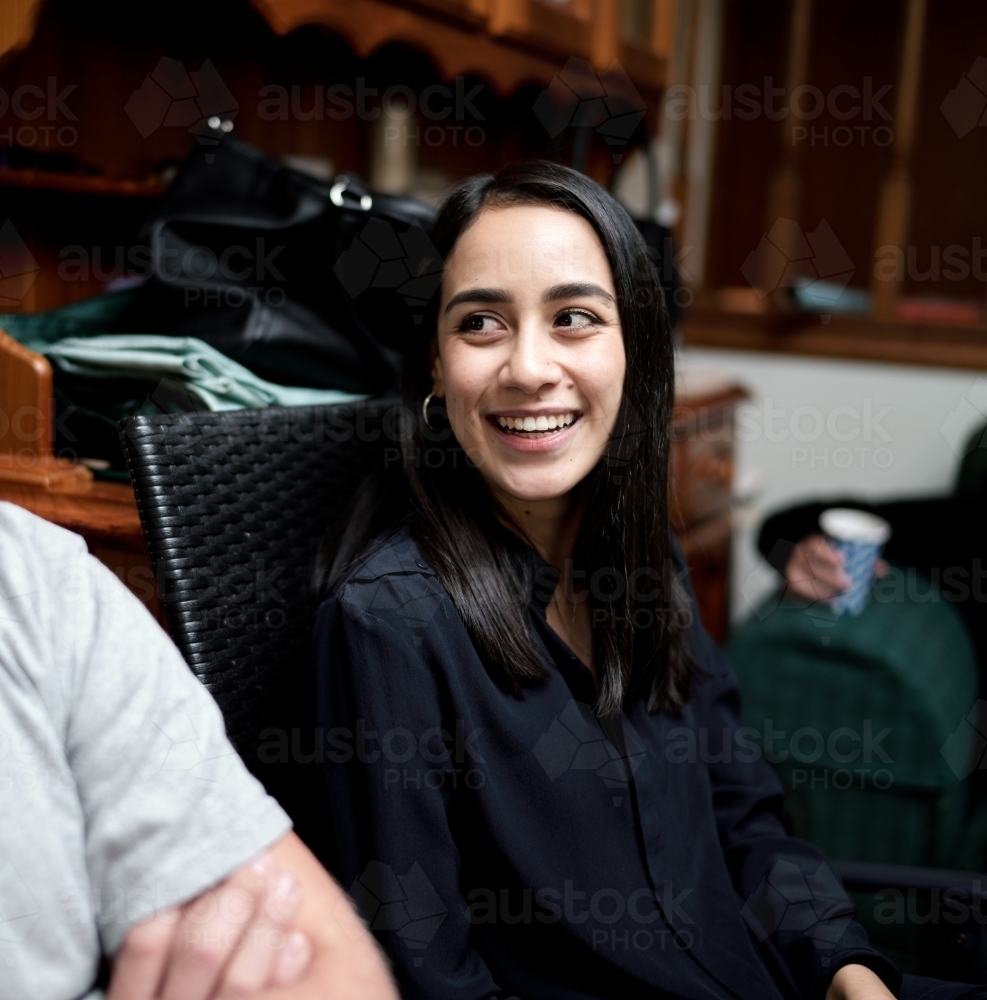 Young Smiling Woman with Straight Dark Hair - Australian Stock Image