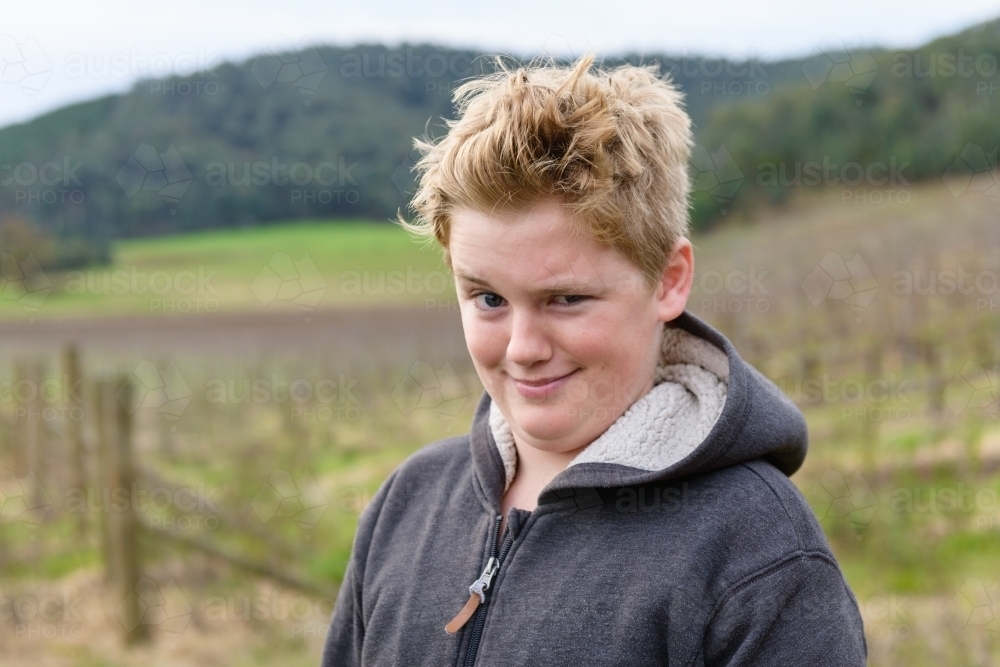 Image of young teen boy making a funny face - Austockphoto