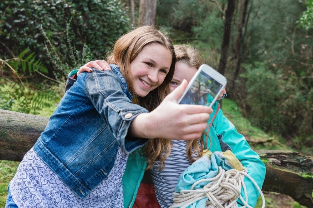 young teen girls take a selfie together - Australian Stock Image