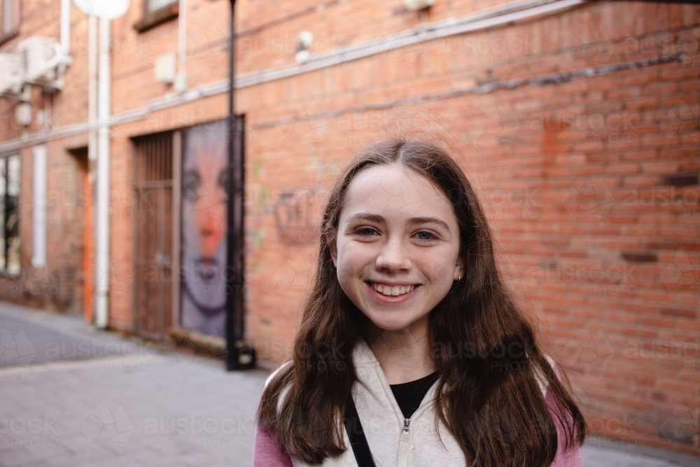 Young teenage girl shopping in town - Australian Stock Image