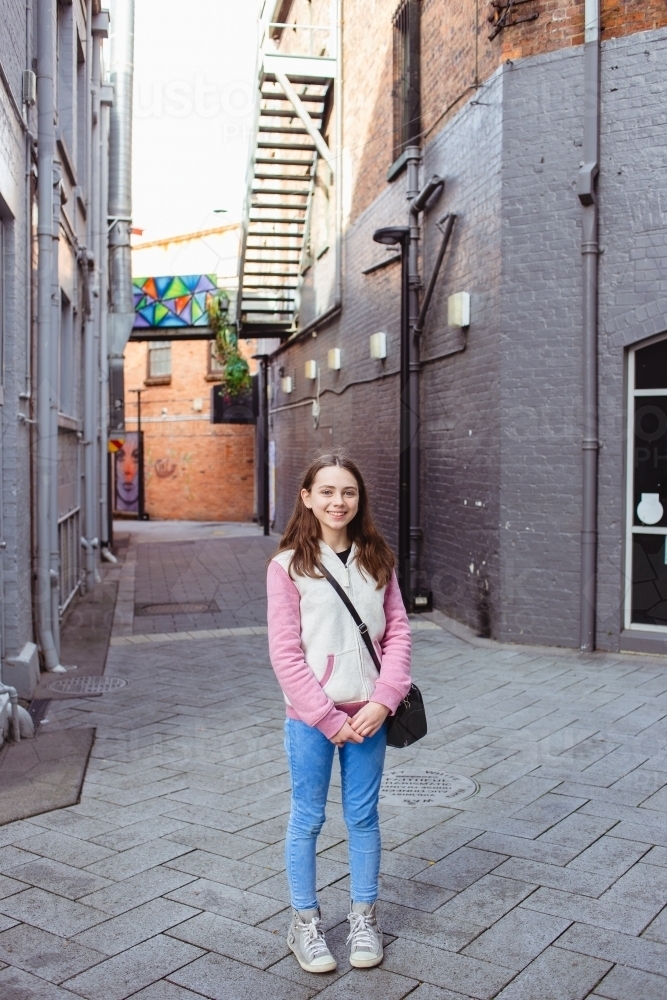 Young teenage girl shopping in town - Australian Stock Image