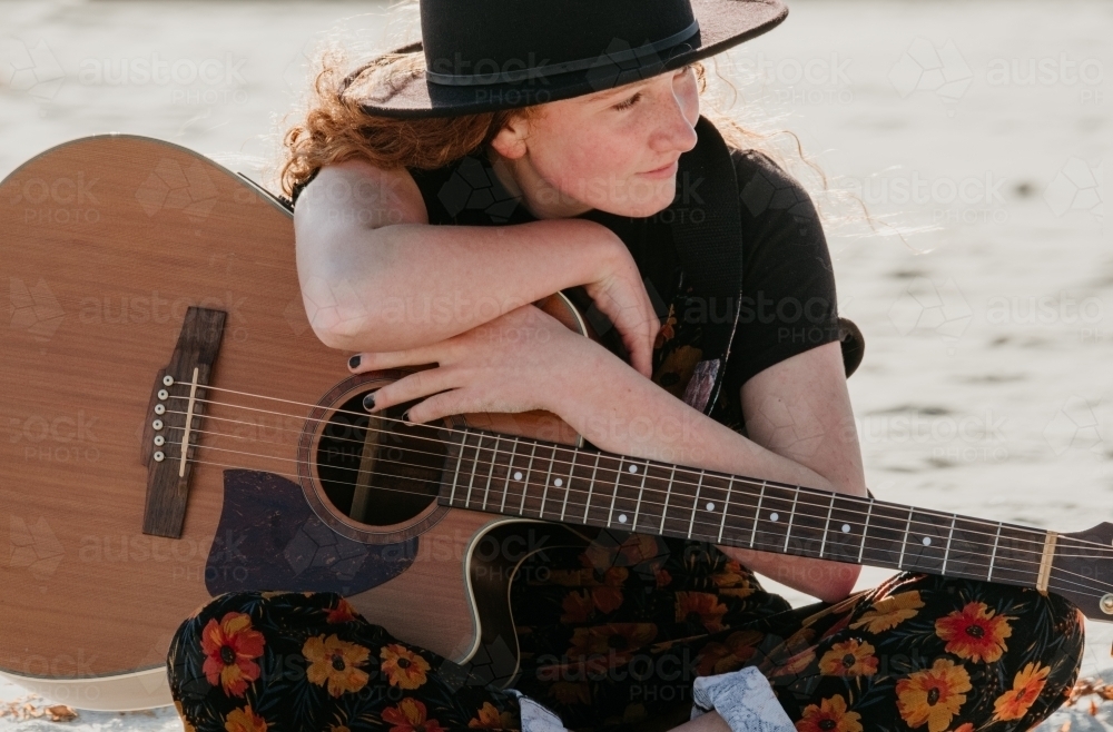 Young teenage girl with guitar. - Australian Stock Image