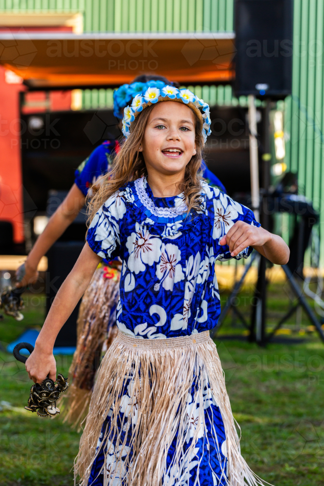 Young Torres Strait Island girl dancing in dance troop at NAIDOC event performance - Australian Stock Image