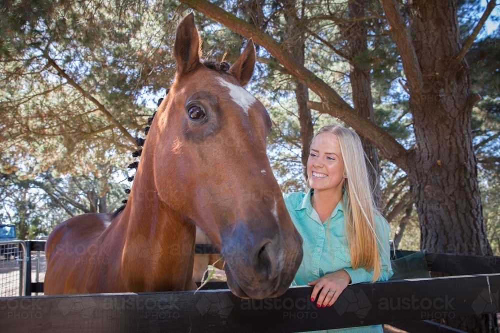 Young Woman and Her Chestnut Horse - Australian Stock Image