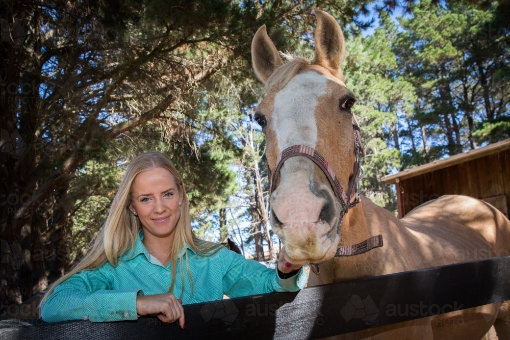Young Woman and Palomino Horse - Australian Stock Image