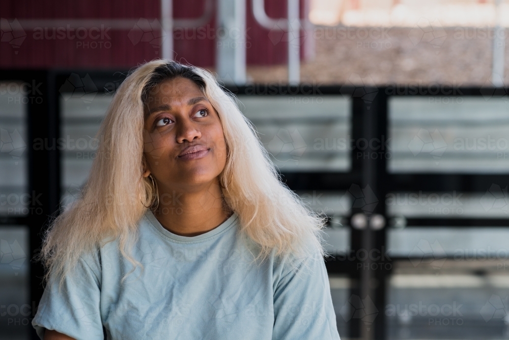 young woman at the train station - Australian Stock Image