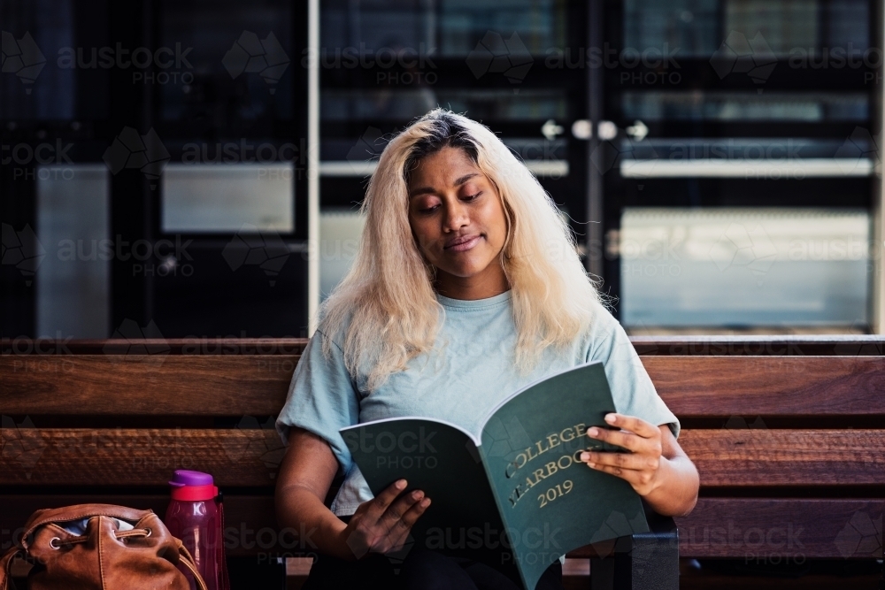 young woman at the train station - Australian Stock Image