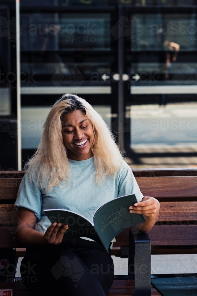 young woman at the train station - Australian Stock Image
