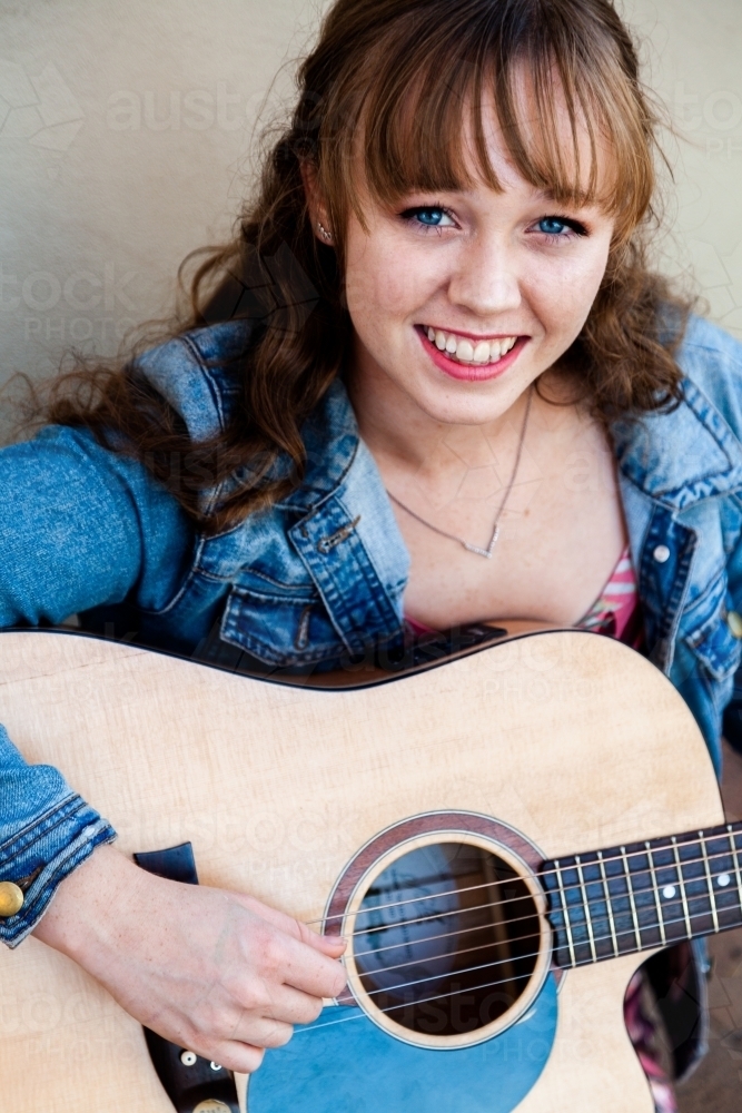 Young woman busking on the street - Australian Stock Image