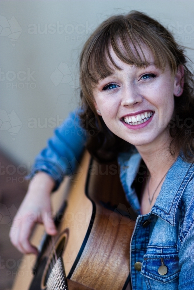 Young woman busking on the street - Australian Stock Image