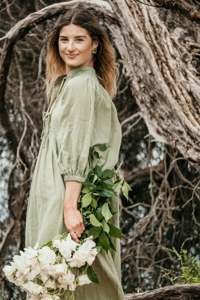 Young woman holds bunch of roses - Australian Stock Image
