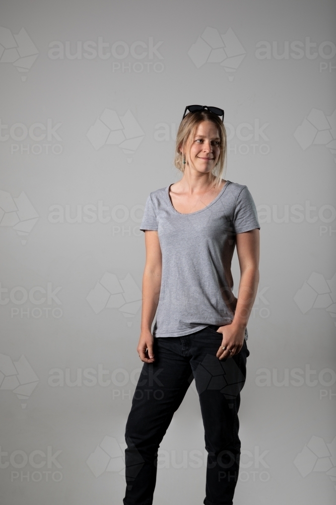Young woman in relaxed pose wearing casual gear - Australian Stock Image
