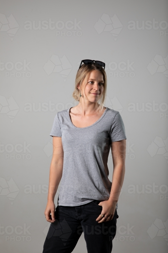 Young woman in relaxed pose wearing casual gear - Australian Stock Image
