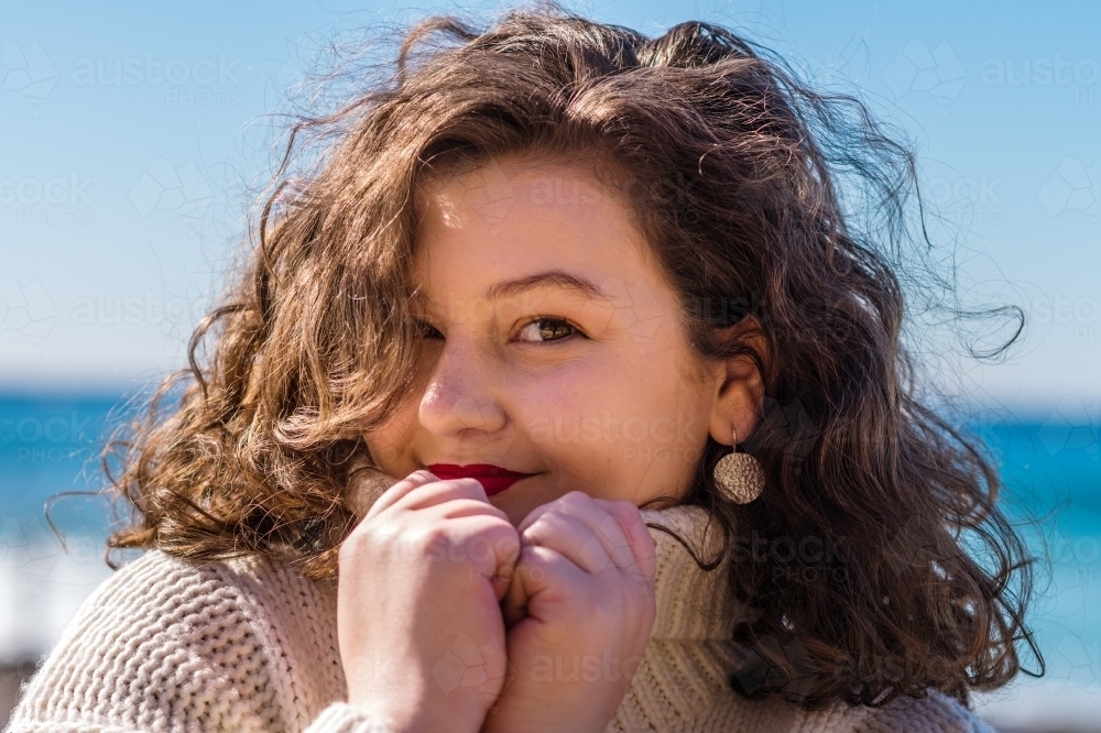 young woman in warm jumper - Australian Stock Image