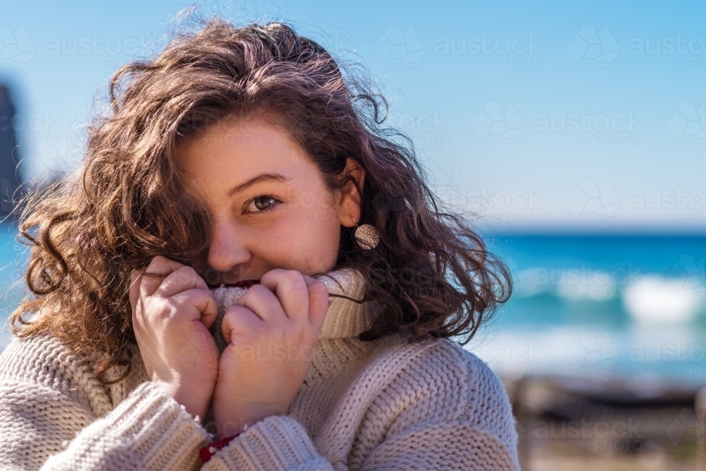 young woman in warm jumper - Australian Stock Image