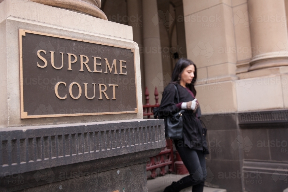 Young Woman Leaving Supreme Court - Australian Stock Image