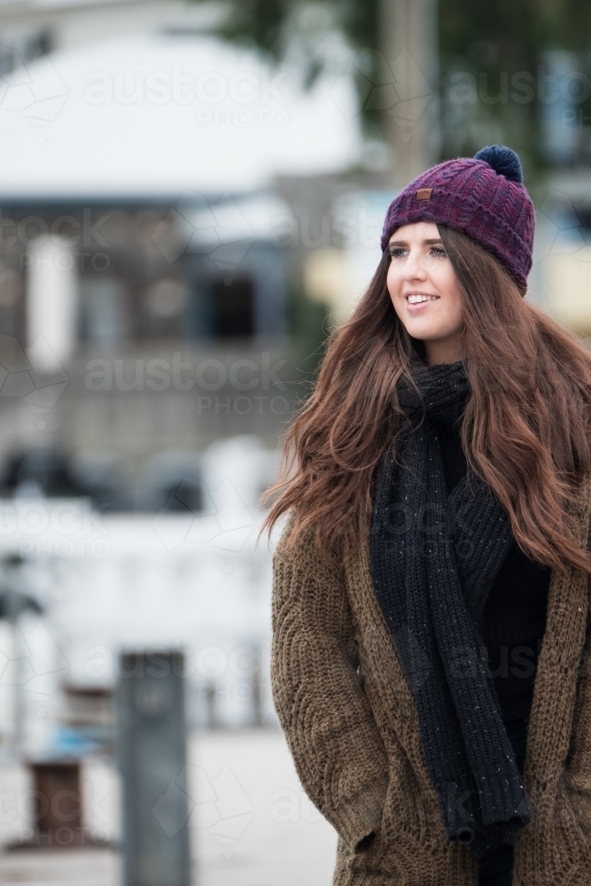 Young woman outdoors dressed for winter. - Australian Stock Image