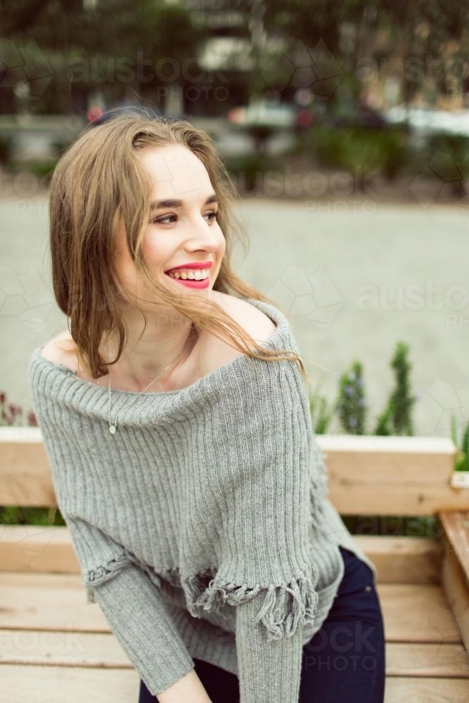 Young woman posing and smiling in the city - Australian Stock Image