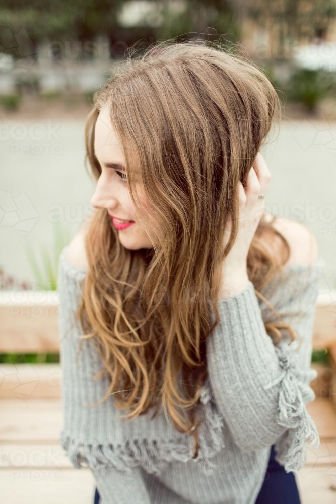 Young woman posing and smiling in the city - Australian Stock Image