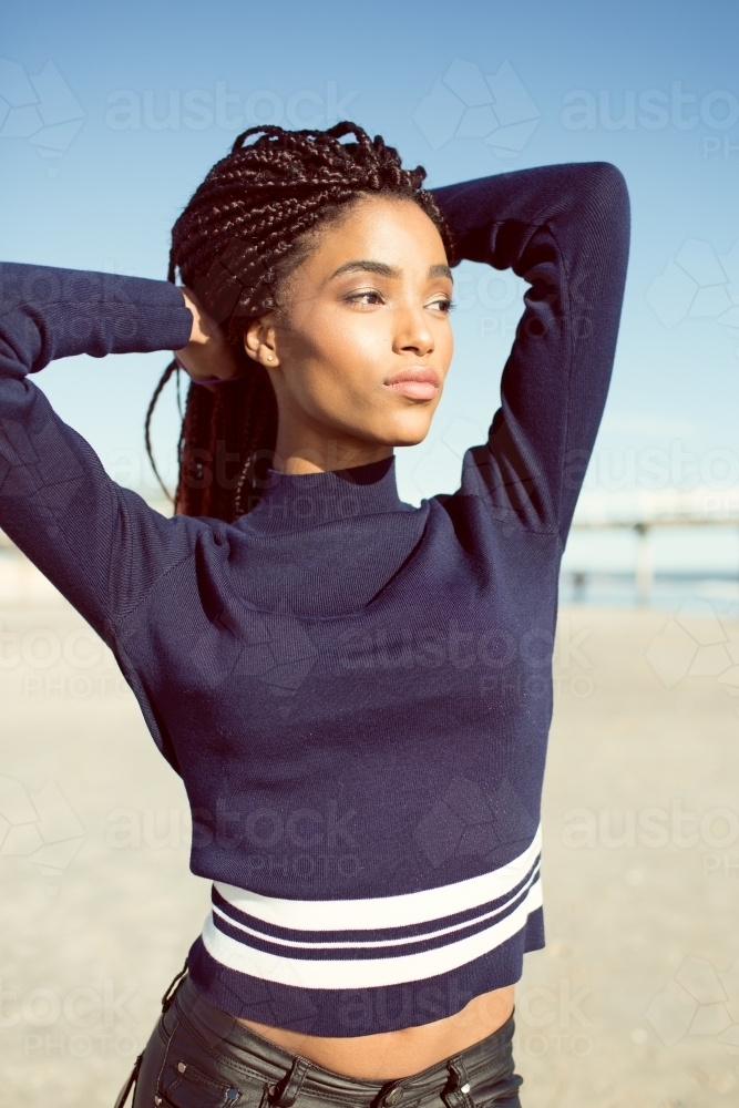Young woman posing on a beach - Australian Stock Image