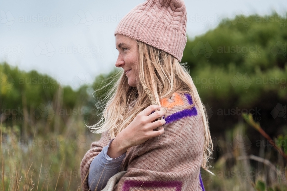 Young woman's profile outdoors. - Australian Stock Image