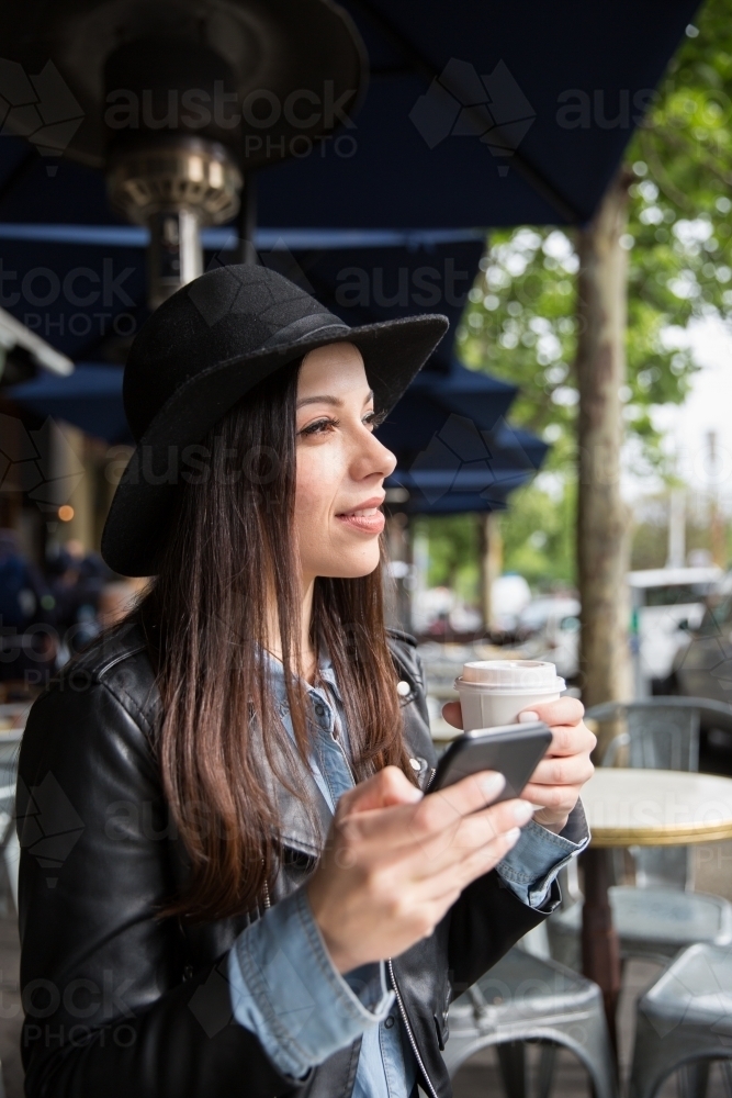 Young Woman Sitting in an Outdoor Cafe - Australian Stock Image