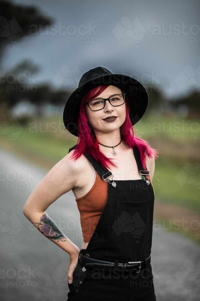 Young woman standing with hands on hips - Australian Stock Image