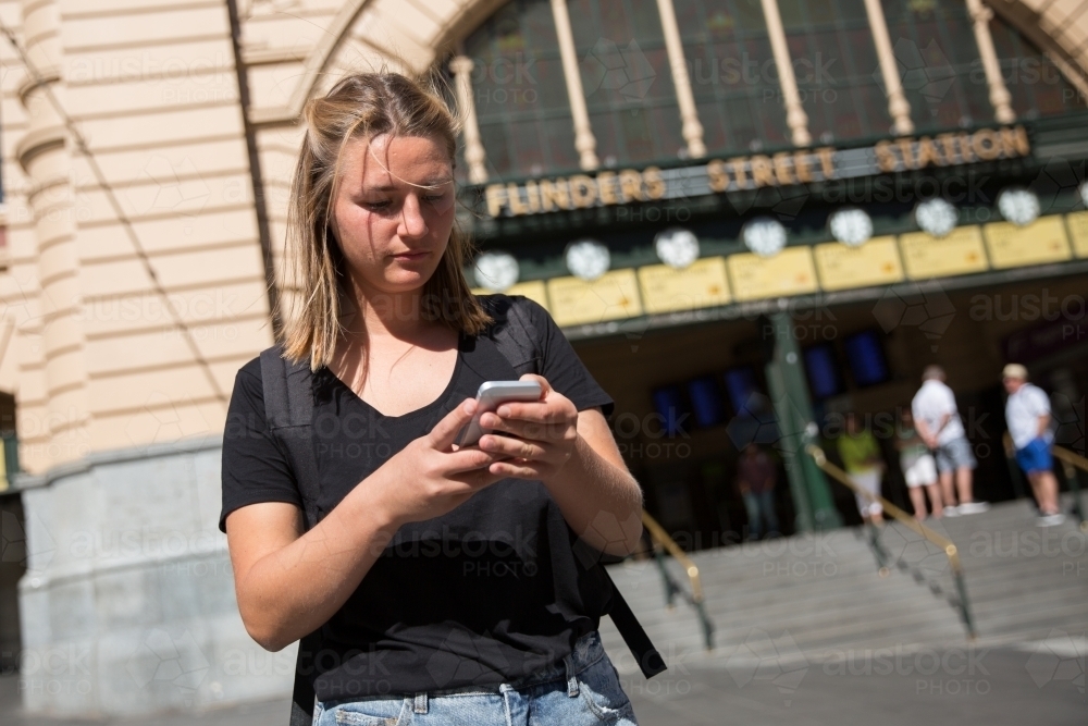Young Woman Waiting Outside Flinders Street Staiton - Australian Stock Image